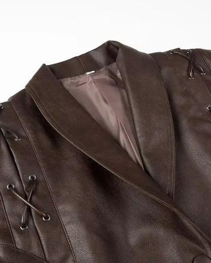 Liora Structured Wrap Jacket in rich faux leather with exaggerated shoulders and decorative lacing details.