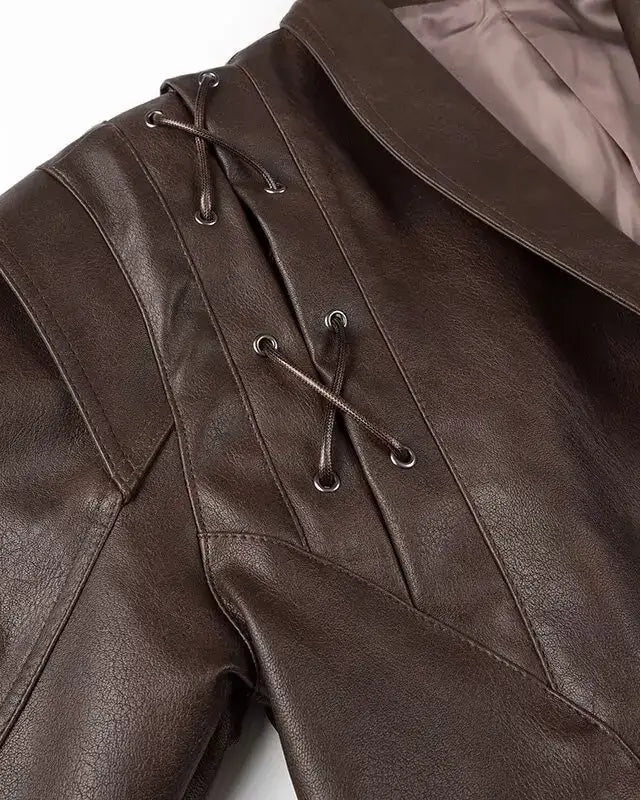 Close-up of Liora Structured Wrap Jacket with faux leather detail and stylish lacing in rich chocolate tone.