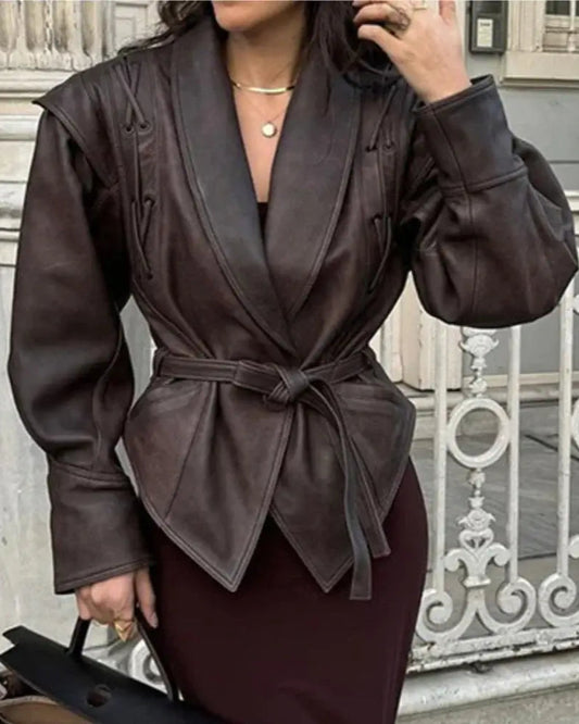 Liora Structured Wrap Jacket in rich chocolate faux leather with exaggerated shoulders and cinched waist, perfect for modern feminine style.