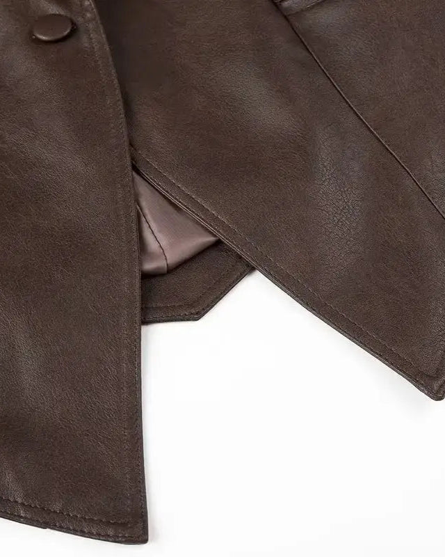 Liora Structured Wrap Jacket showcasing rich faux leather in deep chocolate, with structured silhouette and wide lapels.